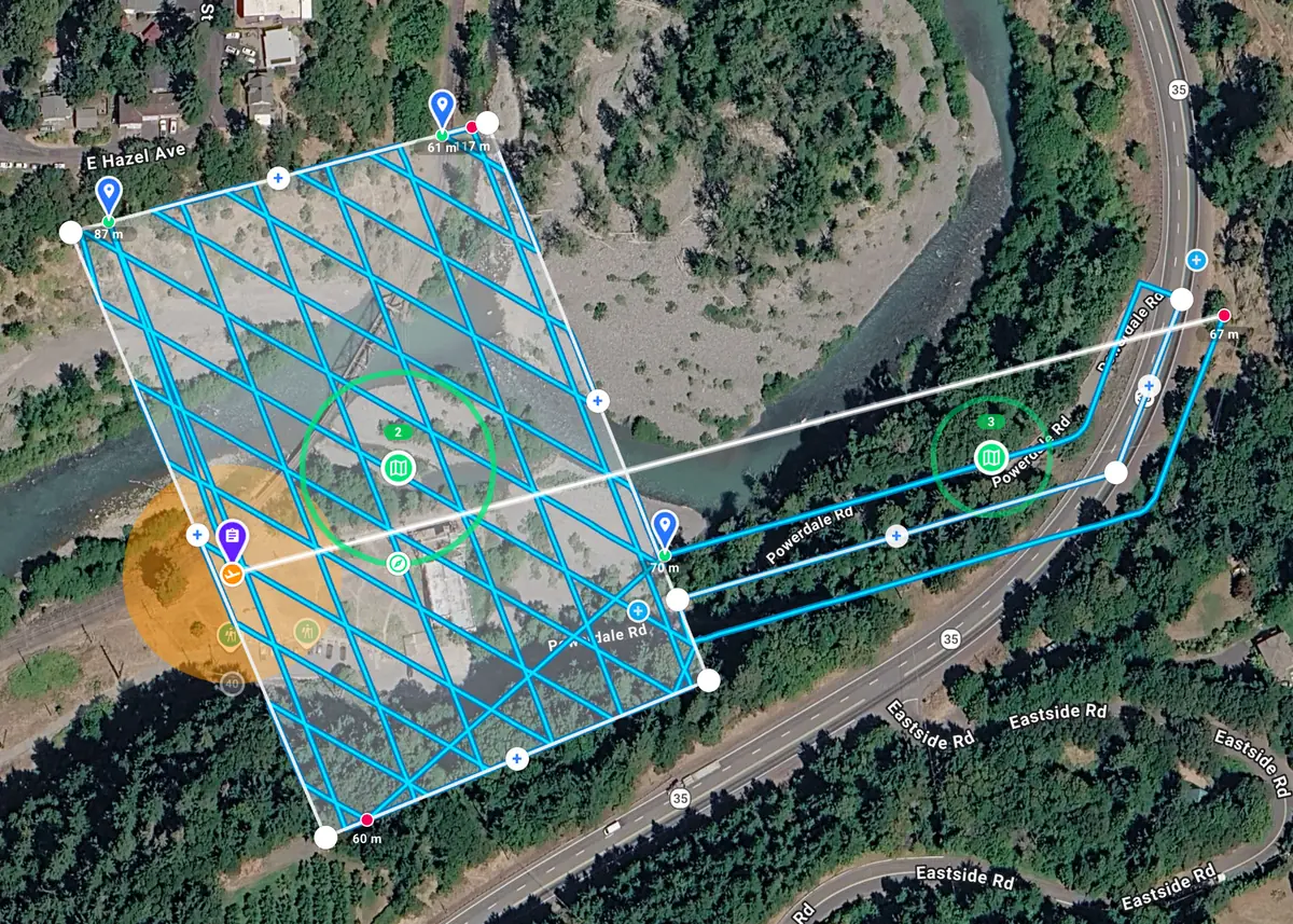 Crosshatch mapping grid planned over a river, with a linear mapping corridor along the road beside it