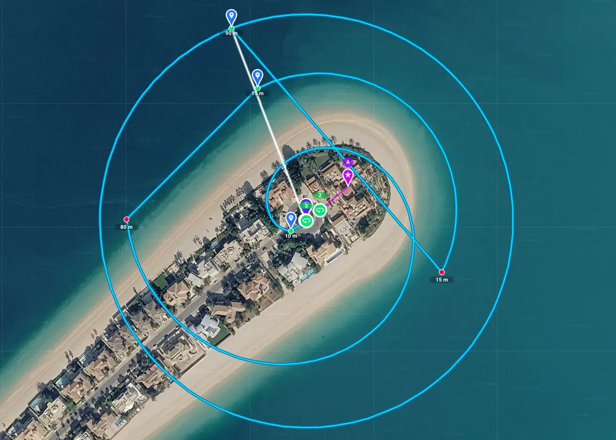 Circle and spiral orbits planned around a point of interest at the tip of a beachfront island